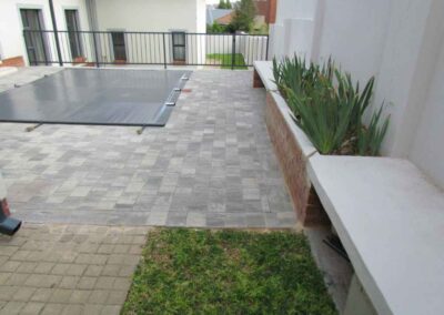 Rietvlei Heights Estate Swimming Pool Paving Granite Pavers Laid In A Stretcher Bond