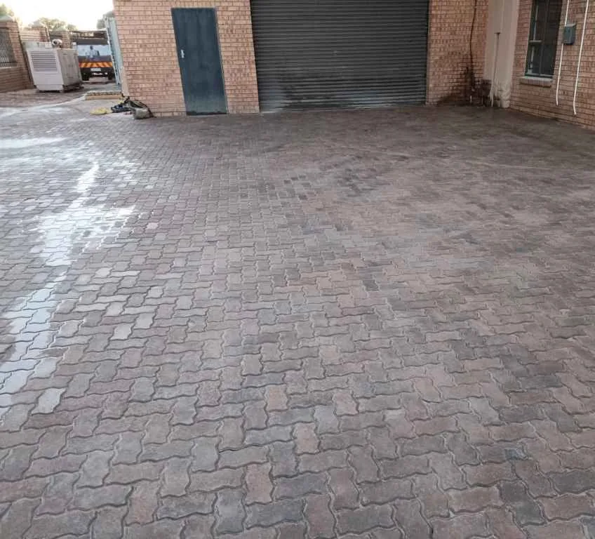 Commercial & Industrial Paving Pretoria | Pretoria Paving 9 Loading zone paved in 80 mm interlockers outside a roller-shutter door at Famous Brands in Hennopspark