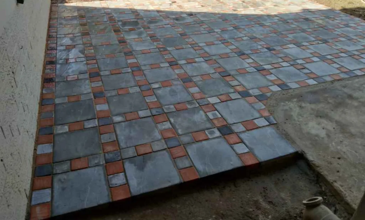 Patio & Entertainment Area Paving | Pretoria Paving 13 Wet-cast Tuscan Stone square slabs with a contrasting small-unit lattice at a home in Villieria, Pretoria